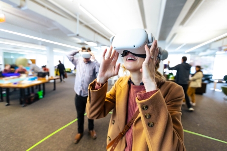 A woman wearing VR goggles