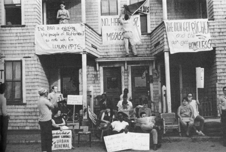 Protesters hanging banners at a housing complex protest against highways in Cambridge, MA, 1960