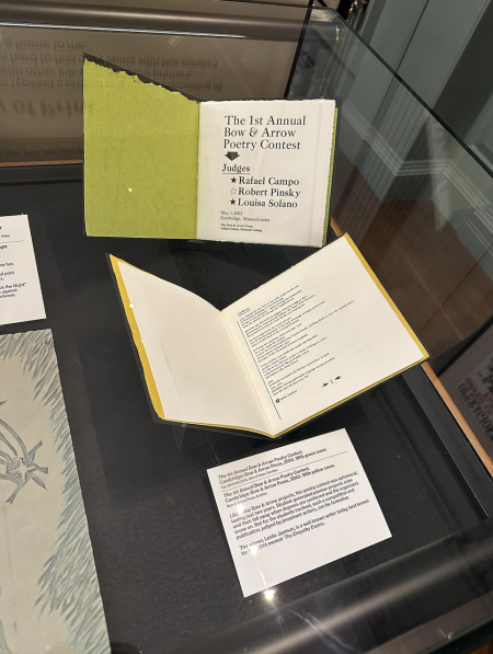 A display of books printed at the Bow & Arrow Press. The first book is opened to a page that says "The 1st Annual Bow & Arrow Poetry Contest"